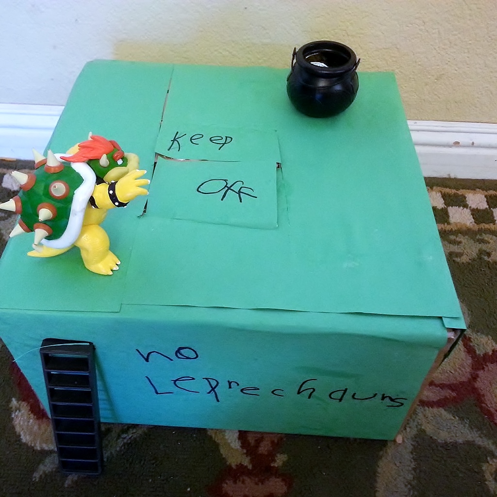 Easy Leprechaun Trap for St Patrick's Day fun. Made with a cardboard box, a pot of gold and some basic craft supplies.