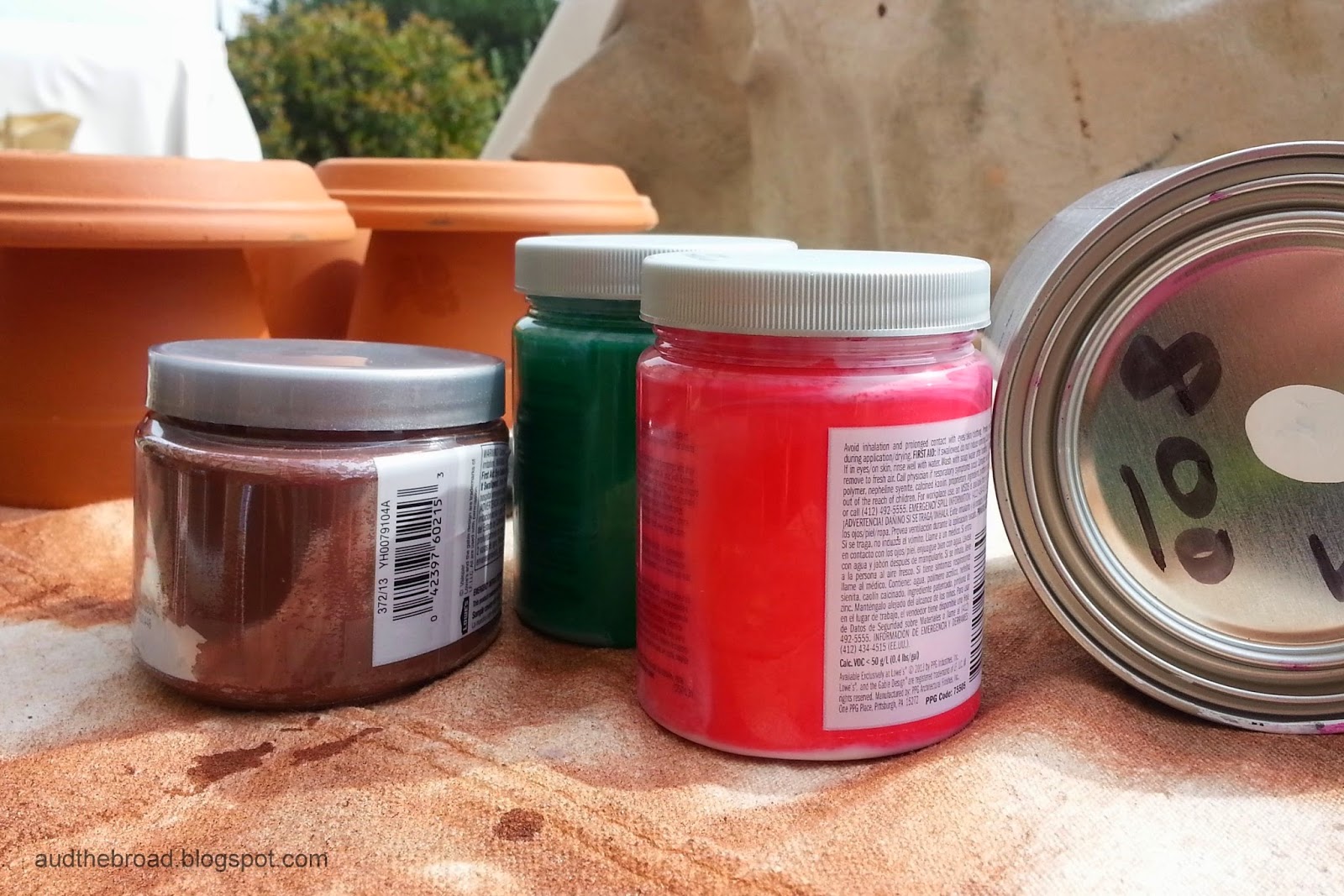 sample paint jars and clay pots