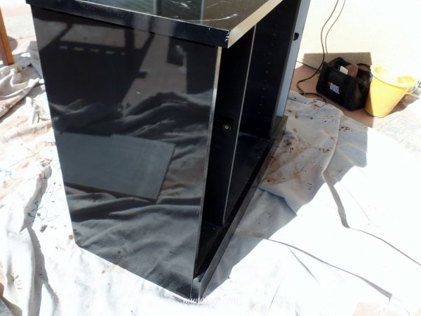 Furniture refinish - glossy black TV stand to a toy shelf.