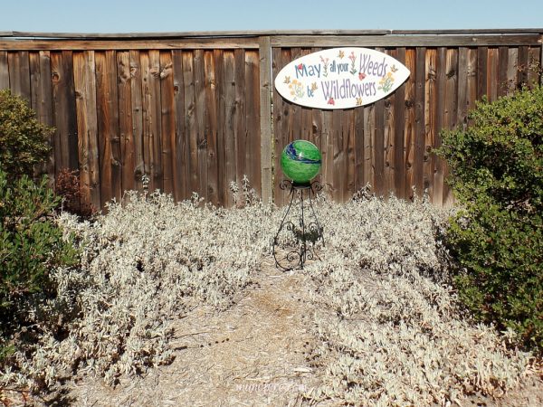 Fun Garden Sign - repurpose an old skim board into a whimsical garden sign. Garden Art. Upcycle. DIY.