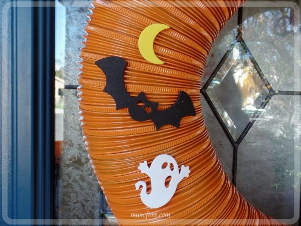 From trash to treasure - an old dryer vent becomes a festive Halloween wreath. Halloween craft, dryer vent pumpkin, easy Halloween decoration.