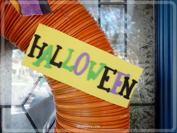 From trash to treasure - an old dryer vent becomes a festive Halloween wreath. Halloween craft, dryer vent pumpkin, easy Halloween decoration.