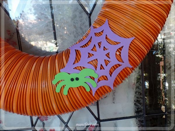 From trash to treasure - an old dryer vent becomes a festive Halloween wreath. Halloween craft, dryer vent pumpkin, easy Halloween decoration.