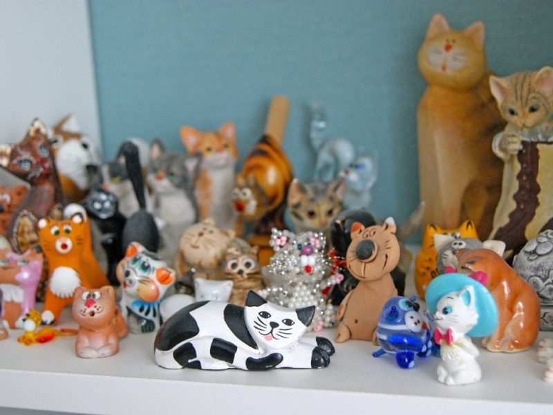a collection of cat figurines