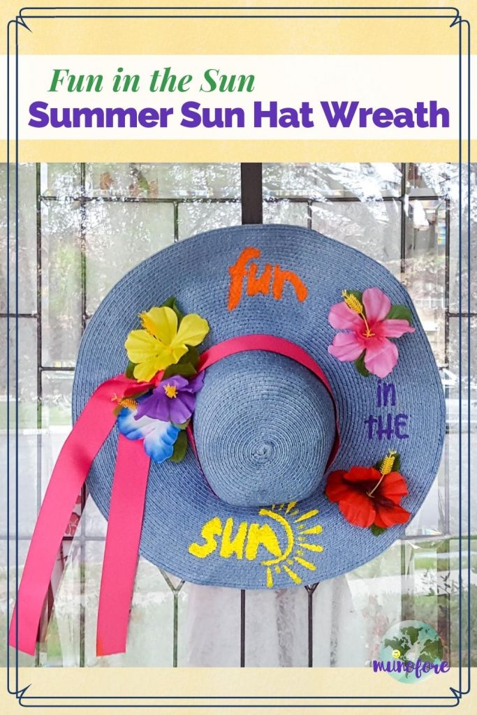 Decorated summer beach hat hung on a door with text overlay "Fun in the Sun Summer Sun Hat Wreath"