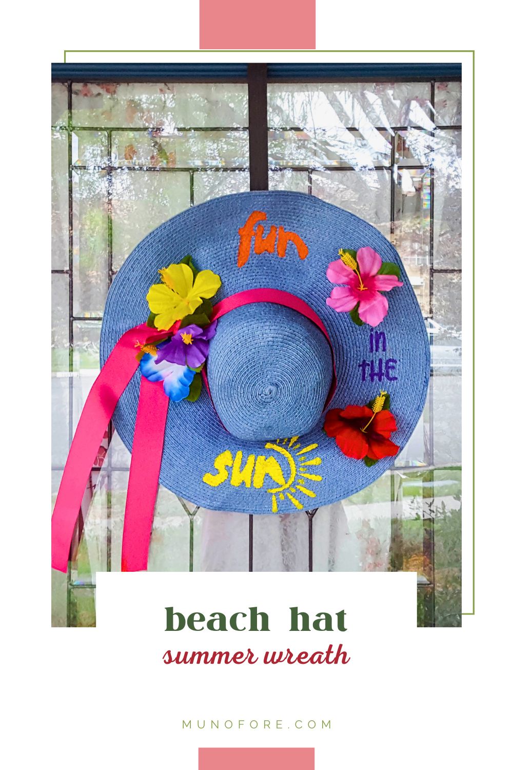 Decorated summer beach hat hung on a door