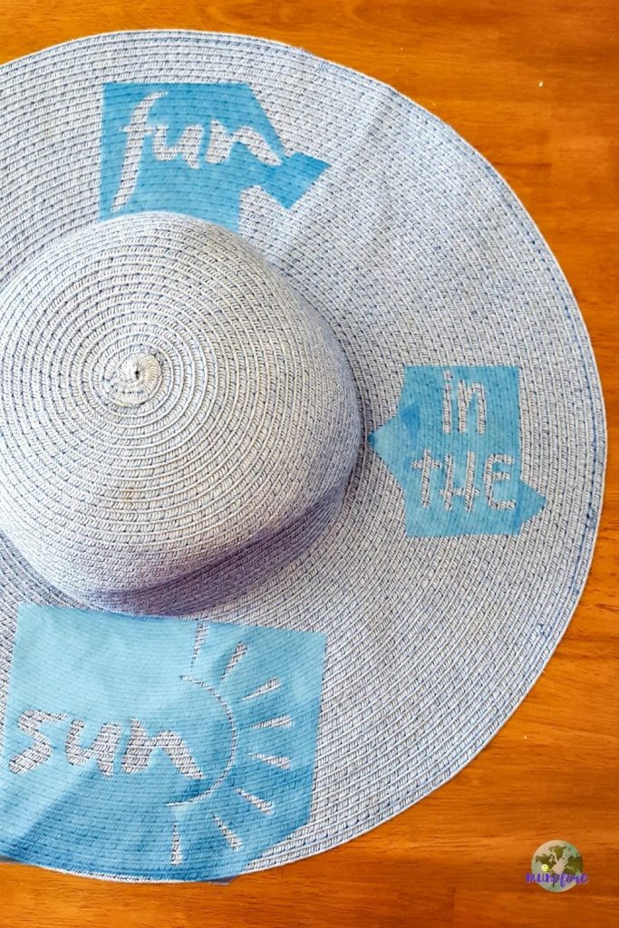 beach hat with stencils stuck on it