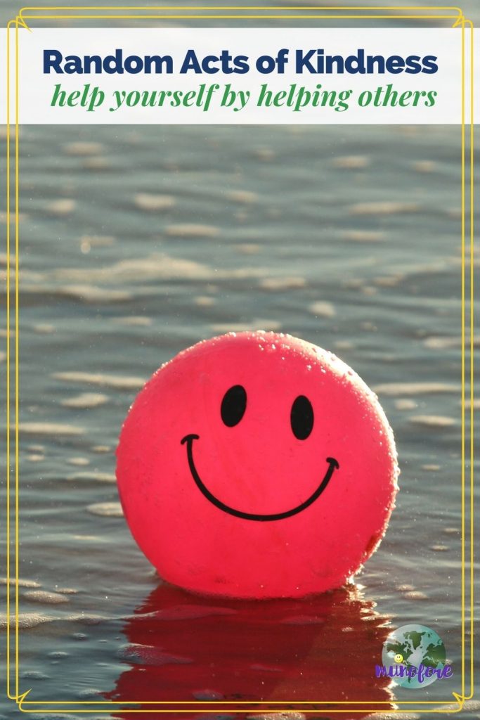 ball with smiley face floating on water with text overlay "Random Acts of Kindness help yourself by helping others