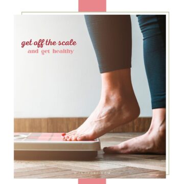 woman tentatively stepping on scale